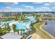 Aerial view of resort pool and community, featuring a lagoon at 3037 Sea Plane Ln, Kissimmee, FL 34747