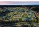 Aerial view of a water park at night, showing illuminated slides and pools at 3037 Sea Plane Ln, Kissimmee, FL 34747