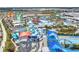 Aerial view of a vibrant water park with slides, pools, and colorful structures at 3037 Sea Plane Ln, Kissimmee, FL 34747