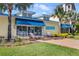 Upscale shopping center with modern storefronts and inviting outdoor seating at 3037 Sea Plane Ln, Kissimmee, FL 34747