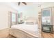 Main bedroom with king-size bed, nightstands and ceiling fan at 3037 Sea Plane Ln, Kissimmee, FL 34747
