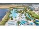Large resort-style pool with plenty of lounge chairs and umbrellas at 3037 Sea Plane Ln, Kissimmee, FL 34747