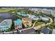 Aerial view of Margaritaville Resort with adjacent houses and pool area at 3037 Sea Plane Ln, Kissimmee, FL 34747