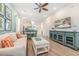 Bright living room features comfy sofas, a large TV, and stylish coffee table at 3037 Sea Plane Ln, Kissimmee, FL 34747
