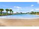 Large, inviting pool with plenty of lounge chairs and umbrellas at 3037 Sea Plane Ln, Kissimmee, FL 34747