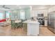 Open concept kitchen with island and dining area, great for entertaining at 3037 Sea Plane Ln, Kissimmee, FL 34747