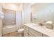 Clean bathroom with a tub shower combo, white vanity, and tile floor at 3037 Sea Plane Ln, Kissimmee, FL 34747