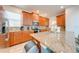 Modern kitchen featuring granite countertops and wood cabinets at 4722 Sleepy Hollow Dr, Kissimmee, FL 34746
