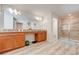 Bathroom with double vanity, granite countertop, soaking tub and walk-in shower at 4722 Sleepy Hollow Dr, Kissimmee, FL 34746