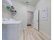 Laundry room with washer, dryer, and shelving at 4722 Sleepy Hollow Dr, Kissimmee, FL 34746