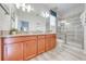 Bathroom with double vanity, granite countertops, and a large shower at 4722 Sleepy Hollow Dr, Kissimmee, FL 34746