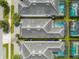 An aerial view of houses showing rooftops and pools at 4722 Sleepy Hollow Dr, Kissimmee, FL 34746