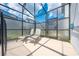 Relaxing pool area with lounge chairs and screened enclosure at 4722 Sleepy Hollow Dr, Kissimmee, FL 34746