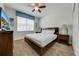 Bedroom with a double bed, dresser, and window with blinds at 4722 Sleepy Hollow Dr, Kissimmee, FL 34746