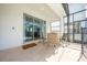 Covered patio with table and chairs, adjacent to pool at 4722 Sleepy Hollow Dr, Kissimmee, FL 34746