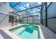 Screened pool and spa area with safety fence at 4722 Sleepy Hollow Dr, Kissimmee, FL 34746