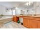 Elegant bathroom with double vanity, granite countertop, soaking tub, and walk-in shower at 4722 Sleepy Hollow Dr, Kissimmee, FL 34746