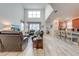 Open concept living room with high ceilings and views to kitchen at 4722 Sleepy Hollow Dr, Kissimmee, FL 34746
