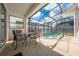 Relaxing patio with table and chairs overlooking pool at 4722 Sleepy Hollow Dr, Kissimmee, FL 34746