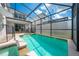 Inviting screened pool with spa and safety fence at 4722 Sleepy Hollow Dr, Kissimmee, FL 34746