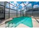 Refreshing screened pool with spa and safety fence at 4722 Sleepy Hollow Dr, Kissimmee, FL 34746