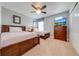 Bedroom with a double bed and a twin bed, ceiling fan, and dresser at 4722 Sleepy Hollow Dr, Kissimmee, FL 34746