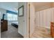 View of bedroom and bathroom with shower/tub combo and vanity at 4722 Sleepy Hollow Dr, Kissimmee, FL 34746