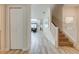 Bright entry hall with tile flooring, leading to living areas and staircase at 4722 Sleepy Hollow Dr, Kissimmee, FL 34746