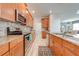 Modern kitchen with granite countertops and wood cabinets at 4722 Sleepy Hollow Dr, Kissimmee, FL 34746