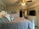 Main bedroom with king-size bed and coastal-inspired decor at 5300 S Atlantic Ave # 19-306, New Smyrna Beach, FL 32169