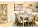 Bright dining area with a wooden table and seating for six at 5300 S Atlantic Ave # 19-306, New Smyrna Beach, FL 32169