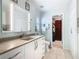Updated bathroom with a toilet, vanity, and access to a walk-in closet at 205 Bell Tower W Xing, Kissimmee, FL 34759