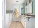 Modern bathroom with walk-in shower, double vanity, and updated fixtures at 205 Bell Tower W Xing, Kissimmee, FL 34759