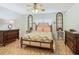 Guest bedroom with a full-size bed and wood furniture at 205 Bell Tower W Xing, Kissimmee, FL 34759