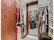 Spacious walk-in closet with custom built-ins and mirror at 205 Bell Tower W Xing, Kissimmee, FL 34759