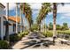 Palm tree-lined walkway leading to community building at 205 Bell Tower W Xing, Kissimmee, FL 34759