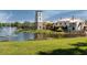 Peaceful community with a pond, fountain and clubhouse at 205 Bell Tower W Xing, Kissimmee, FL 34759