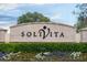 Solvita community entrance sign with landscaping at 205 Bell Tower W Xing, Kissimmee, FL 34759