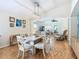 Light and airy dining room with a six-person table and view to the living room at 205 Bell Tower W Xing, Kissimmee, FL 34759