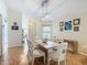 Bright dining area with a modern table, chairs and decorative wall art at 205 Bell Tower W Xing, Kissimmee, FL 34759