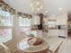 White kitchen with butcher block countertops and stainless steel appliances at 205 Bell Tower W Xing, Kissimmee, FL 34759