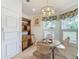 Bright kitchen with wood table and chairs, and white cabinets at 205 Bell Tower W Xing, Kissimmee, FL 34759