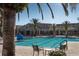 Community lap pool with lounge chairs at 205 Bell Tower W Xing, Kissimmee, FL 34759