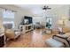 Spacious living room with tiled floor, comfortable seating, and large TV at 205 Bell Tower W Xing, Kissimmee, FL 34759