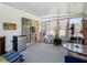 Relaxing sunroom with access to the backyard and mini-fridge at 205 Bell Tower W Xing, Kissimmee, FL 34759