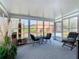 Bright sunroom boasts ample natural light and comfortable seating at 205 Bell Tower W Xing, Kissimmee, FL 34759