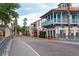 Quaint street view of colorful buildings and palm trees at 205 Bell Tower W Xing, Kissimmee, FL 34759