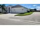 Two-story house with three-car garage and manicured lawn at 3866 Cabo Rojo Dr, Saint Cloud, FL 34772