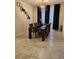 Elegant dining room, featuring a dark wood table and blue curtains at 3866 Cabo Rojo Dr, Saint Cloud, FL 34772