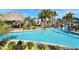 Resort-style pool with a water slide and tiki hut at 1077 Quaker Ridge Ln, Davenport, FL 33896
